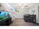 Dining area featuring wood-look floors and nearby stairway at 705 Lake Ada Blvd, Dundee, FL 33838