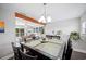 Elegant dining room adjacent to a spacious living area, perfect for entertaining guests at 705 Lake Ada Blvd, Dundee, FL 33838