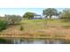 Beautiful exterior view of house on hill overlooking the lake at 705 Lake Ada Blvd, Dundee, FL 33838