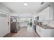 Spacious, open kitchen featuring stainless appliances, granite countertops, and plenty of natural light at 705 Lake Ada Blvd, Dundee, FL 33838
