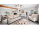 Inviting living room featuring stylish furnishings and seamlessly connects to the dining area at 705 Lake Ada Blvd, Dundee, FL 33838