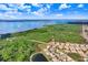 Scenic aerial shot of the property next to a lake and wooded surroundings at 116 Ocean Bluff Dr # 116, Kissimmee, FL 34759