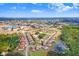 An aerial image showing the property nestled in a neighborhood with pond access at 116 Ocean Bluff Dr # 116, Kissimmee, FL 34759