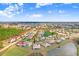 Aerial view of the home with a lake and many other houses in the community at 116 Ocean Bluff Dr # 116, Kissimmee, FL 34759