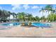 Enjoy a community pool surrounded by palm trees and lounging areas at 116 Ocean Bluff Dr # 116, Kissimmee, FL 34759