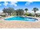 Outdoor community pool with chairs and tables, perfect for relaxation at 116 Ocean Bluff Dr # 116, Kissimmee, FL 34759