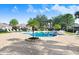 Large outdoor pool surrounded by palm trees and lounge chairs at 116 Ocean Bluff Dr # 116, Kissimmee, FL 34759