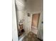 Bathroom featuring a shower, tiled floors, doorway into the room and needs some work at 118 S 5Th St, Haines City, FL 33844