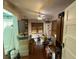 View of bedroom with hardwood floors, ceiling fan, and a large window with wooden blinds at 118 S 5Th St, Haines City, FL 33844