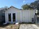 Exterior view of shed featuring a doorway and side doors at 118 S 5Th St, Haines City, FL 33844