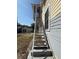 Exterior view looking up the staircase to the second-story screened porch at 118 S 5Th St, Haines City, FL 33844