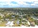 Aerial view of a community highlighting property lines in a lush green neighborhood at 1290 S Mcadoo Ave, Bartow, FL 33830