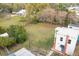 Aerial view of a sprawling green backyard, utility pole, and house at 1290 S Mcadoo Ave, Bartow, FL 33830