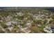 Aerial view of a residential neighborhood with tree-lined streets and homes at 1290 S Mcadoo Ave, Bartow, FL 33830