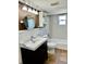 Bright bathroom with a modern vanity, updated fixtures, and a shower-tub combo at 1290 S Mcadoo Ave, Bartow, FL 33830