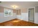 Bedroom features hardwood floors, built in shelves, and natural light from the window at 1290 S Mcadoo Ave, Bartow, FL 33830