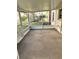 Enclosed porch area with carpeted floor, offering an airy indoor/outdoor space at 1290 S Mcadoo Ave, Bartow, FL 33830