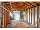 Interior view of backyard shed with storage cabinets and roll-up door at 1290 S Mcadoo Ave, Bartow, FL 33830