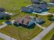 An aerial view of a beautiful single-Gathering home with a large yard and detached garage and screened-in pool at 1301 Hidden Creek Ct, Winter Haven, FL 33880