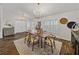 Bright dining room with modern lighting, wood floors, and ample storage space for a sophisticated feel at 1301 Hidden Creek Ct, Winter Haven, FL 33880