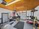 Interior of a garage gym with an American flag and an array of workout equipment at 1301 Hidden Creek Ct, Winter Haven, FL 33880