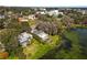 Aerial view of lakefront home with dock near lake mirror in Lakeland at 14 Lake Hollingsworth Dr, Lakeland, FL 33803