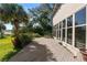 Backyard wooden deck and large windows showcase water view at 14 Lake Hollingsworth Dr, Lakeland, FL 33803