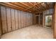 Unfinished basement with concrete block walls, ready for renovations at 14 Lake Hollingsworth Dr, Lakeland, FL 33803