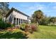 Modern home with a beautiful manicured lawn and large windows at 14 Lake Hollingsworth Dr, Lakeland, FL 33803