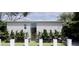 Contemporary exterior with a sleek design and lush, mature landscaping at 14 Lake Hollingsworth Dr, Lakeland, FL 33803