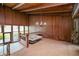 Interior view from an upper level, showcasing a chandelier and wood paneling at 14 Lake Hollingsworth Dr, Lakeland, FL 33803