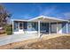 Inviting blue home with a screened porch, covered parking, and a well-maintained lawn that enhances its curb appeal at 140 Jackson Park Ave, Davenport, FL 33897