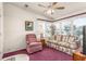 Bright living room featuring large windows, plush carpeting, and comfortable seating at 140 Jackson Park Ave, Davenport, FL 33897