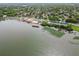 Aerial view showcasing a community center on a lake featuring a pool and well-maintained facilities at 1401 Easton Dr, Lakeland, FL 33803