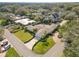 An aerial view showcases the home's landscaping, circular driveway, and well-manicured front lawn at 1401 Easton Dr, Lakeland, FL 33803