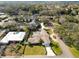 This aerial shot displays the layout of the property, including a pool and the surrounding residential area at 1401 Easton Dr, Lakeland, FL 33803