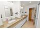 Bathroom featuring granite countertops, double vanity, and modern fixtures creating a spa-like retreat at 1401 Easton Dr, Lakeland, FL 33803