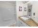 Bathroom featuring a shower-tub combination, vanity with granite countertop, and modern fixtures at 1401 Easton Dr, Lakeland, FL 33803