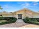 Exterior of home features a well manicured lawn and stone facade at 1401 Easton Dr, Lakeland, FL 33803