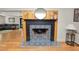 Modern fireplace with decorative tile and wood mantel enhancing the living space at 1401 Easton Dr, Lakeland, FL 33803