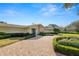 Beautiful home exterior with a well manicured lawn and brick driveway at 1401 Easton Dr, Lakeland, FL 33803