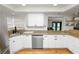 Well-lit kitchen with stainless steel appliances and granite countertops at 1401 Easton Dr, Lakeland, FL 33803