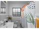 Bathroom featuring a shower-tub combo, updated vanity, and neutral colors at 1632 Sims Pl, Lakeland, FL 33803