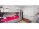 Bright bedroom featuring a bunkbed, wood floors, and closet at 1632 Sims Pl, Lakeland, FL 33803