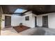 Close-up of the carport featuring a skylight and two entry doors at 1632 Sims Pl, Lakeland, FL 33803