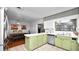 Well-lit kitchen and dining area featuring tile floors, stainless steel appliances and an open design at 1632 Sims Pl, Lakeland, FL 33803