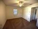 Carpeted bedroom with a ceiling fan and a double-door closet at 1880 N Crystal Lake Dr # 28, Lakeland, FL 33801