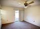 Bedroom featuring carpet flooring, ceiling fan and sliding glass doors at 1880 N Crystal Lake Dr # 28, Lakeland, FL 33801