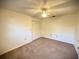 Carpeted bedroom with ceiling fan and double-door closet at 1880 N Crystal Lake Dr # 28, Lakeland, FL 33801