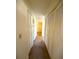 Hallway with carpet and multiple closets at 1880 N Crystal Lake Dr # 28, Lakeland, FL 33801